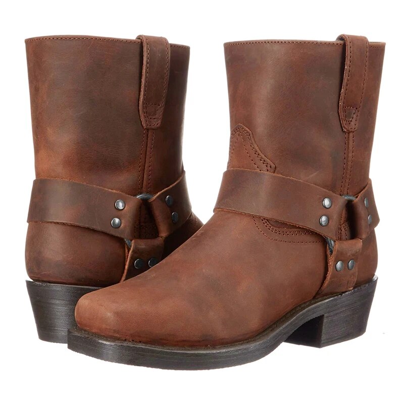 Pair of brown leather harness boots side by side, showing the studded straps, pull tabs and square toes. 4
