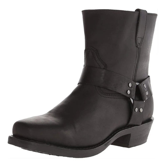 Black version of the leather harness boot at a three-quarter angle, with studded ring strap and block heel. 2