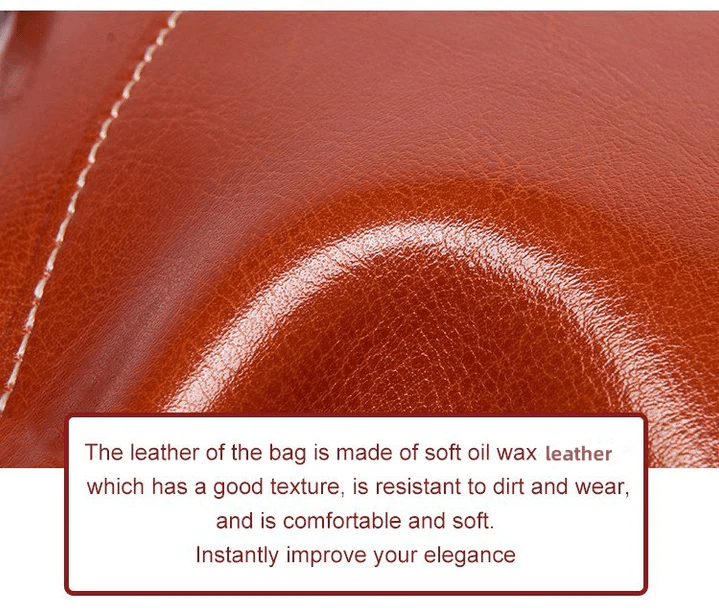 Close-up of the tan oil wax leather grain with a glossy sheen and stitching 14