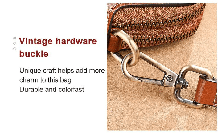 Close-up of a vintage-style brass swivel clip attaching the strap to the tan bag 15