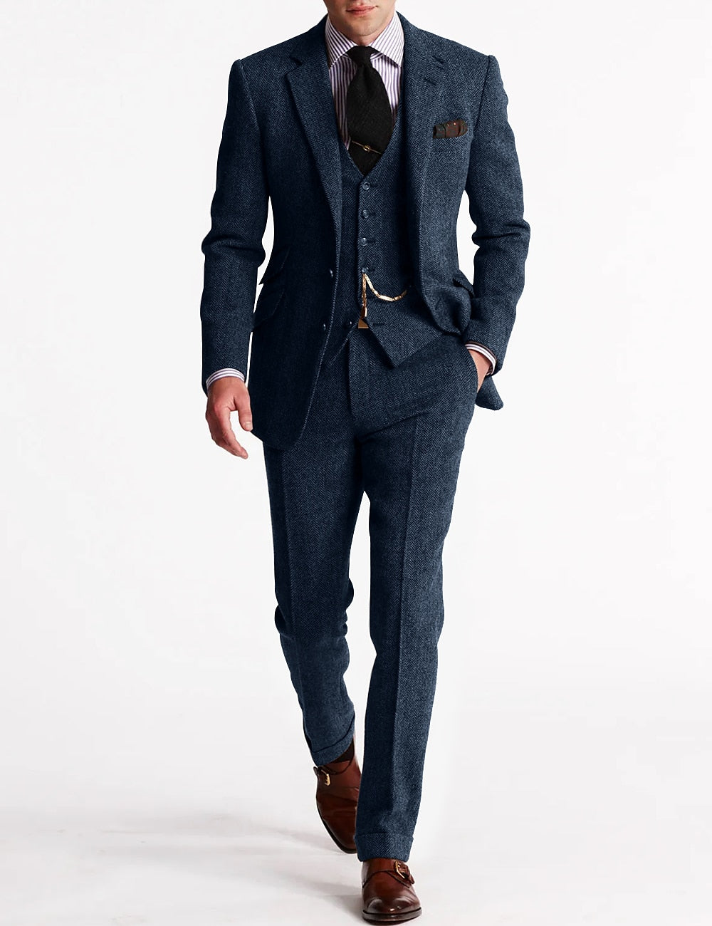 Model in the navy blue herringbone tweed three-piece, with waistcoat chain, striped shirt, black tie and brown shoes 5