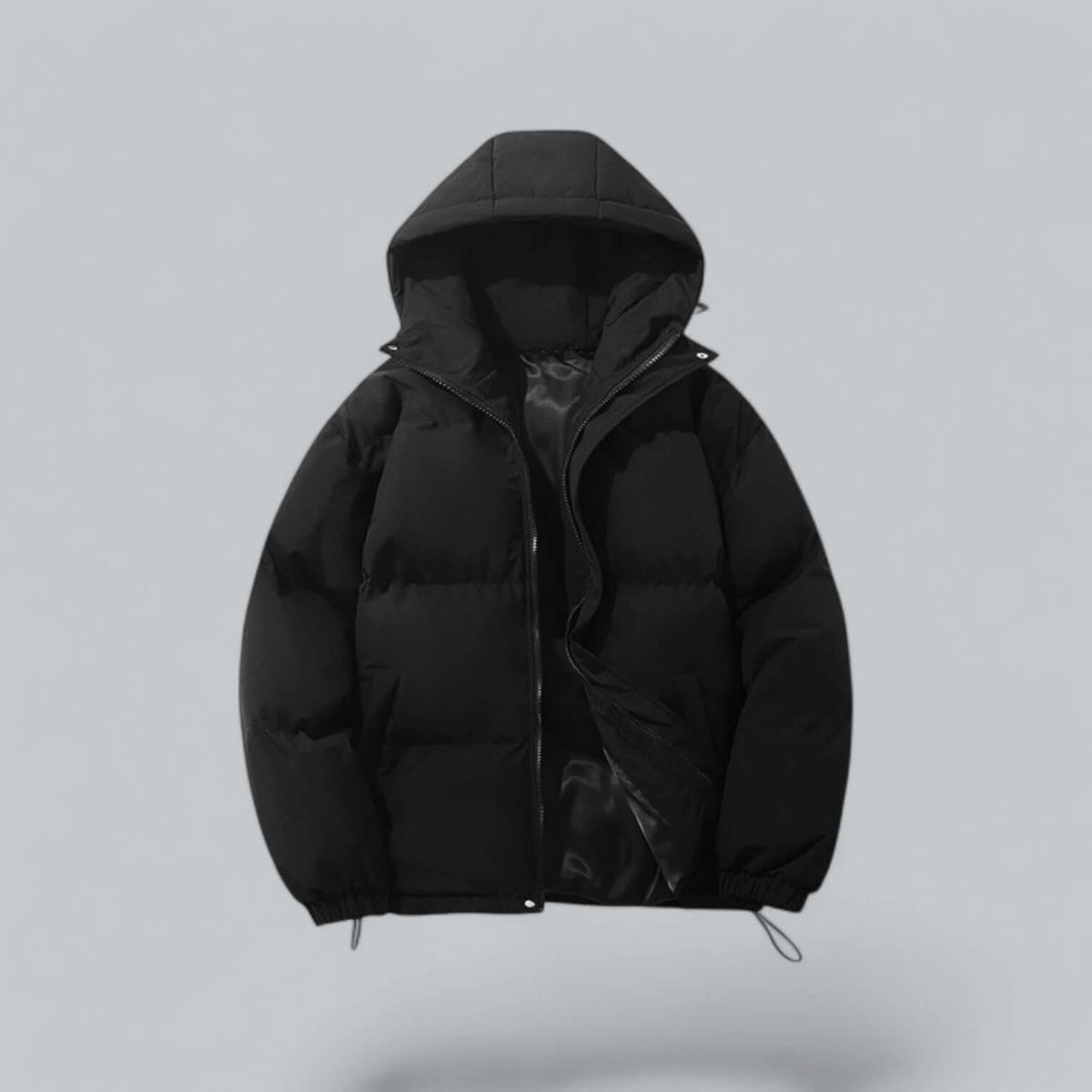 Black quilted hooded puffer jacket, front view with the zip partly open showing the glossy lining and toggle hem cords. 1