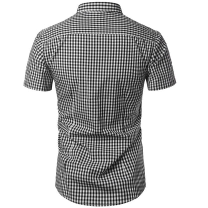 Back view of the black and white gingham shirt, showing the shoulder yoke, short sleeves and curved hem. 8