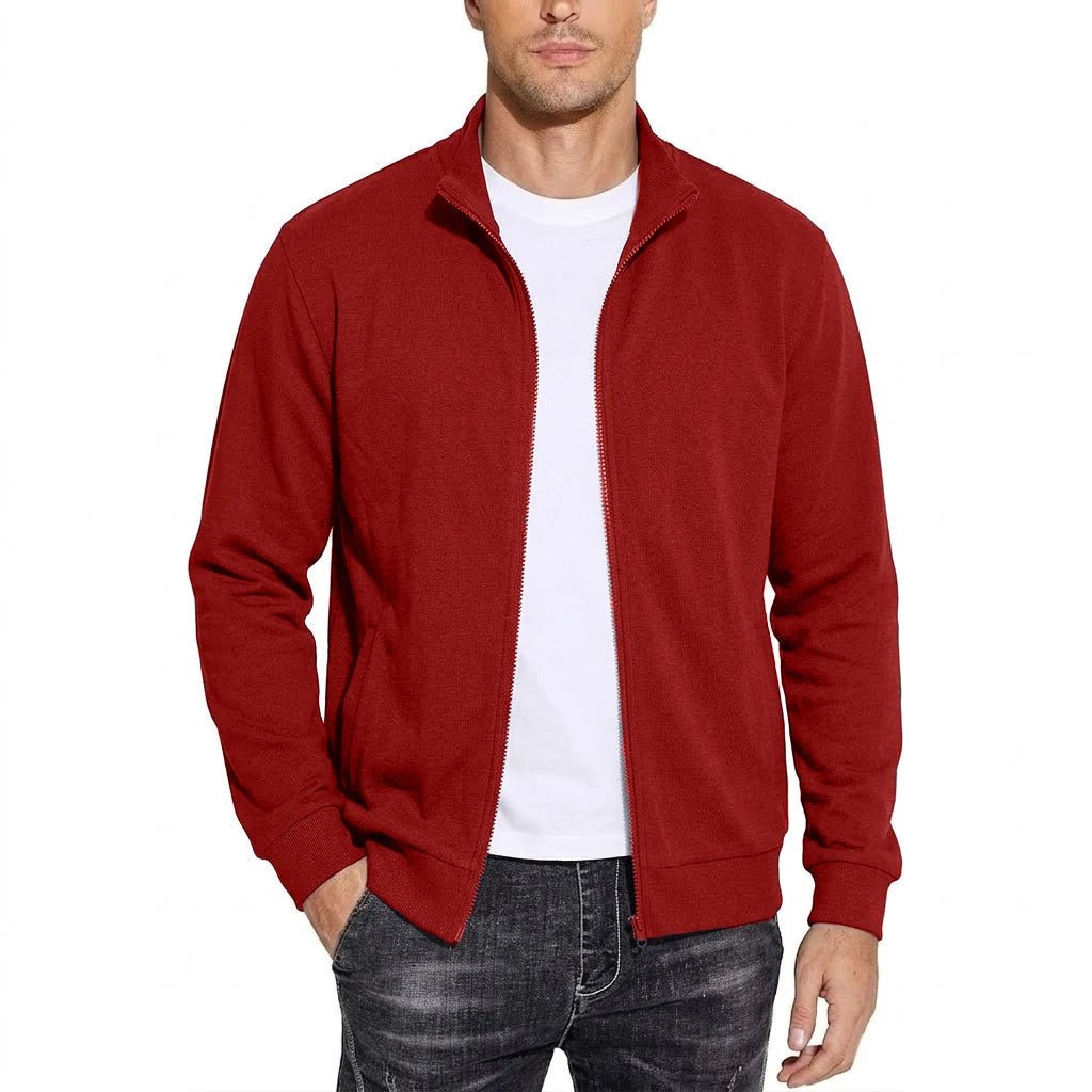 Front view of the zip-up sweatshirt jacket in red, worn open over a white T-shirt with a hand in the pocket. 4