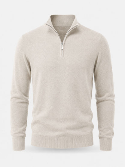 Cream half-zip jumper laid flat, front view showing the open stand collar, silver zip and ribbed cuffs and hem. 12