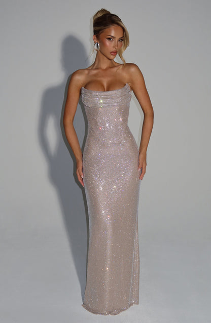 Model wears the pale champagne rhinestone dress, front view, with silver earrings and a sleek updo 15