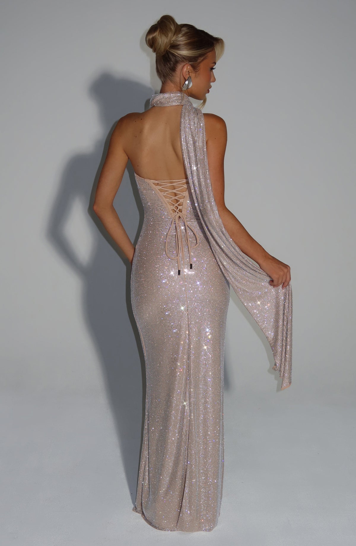 Back view of the champagne dress with the scarf draped across the shoulder and lace-up back visible 19