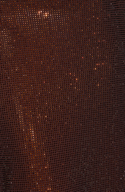 Extreme close-up of the brown mesh fabric covered in tiny sparkling rhinestones 9