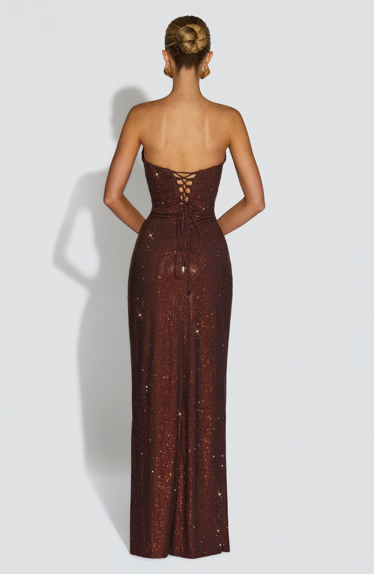 Back view of the brown dress showing the lace-up corset closure and long ties 8