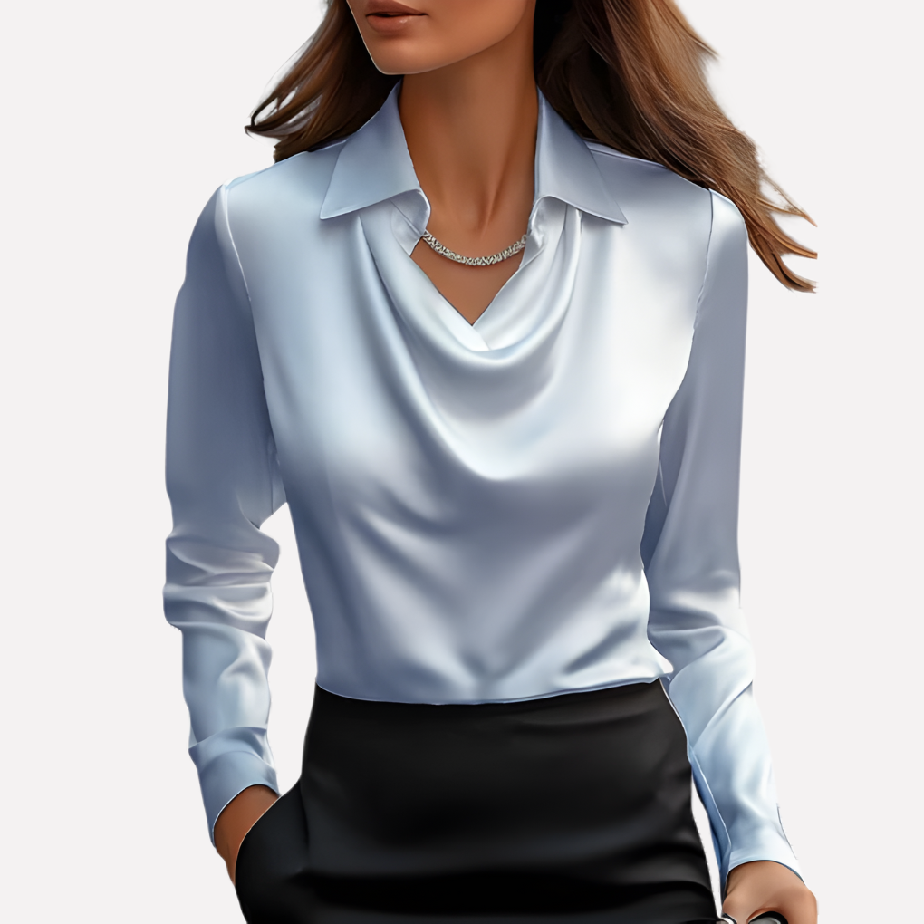 Model wearing the pale blue satin blouse with draped cowl neckline and collar over a black skirt 6