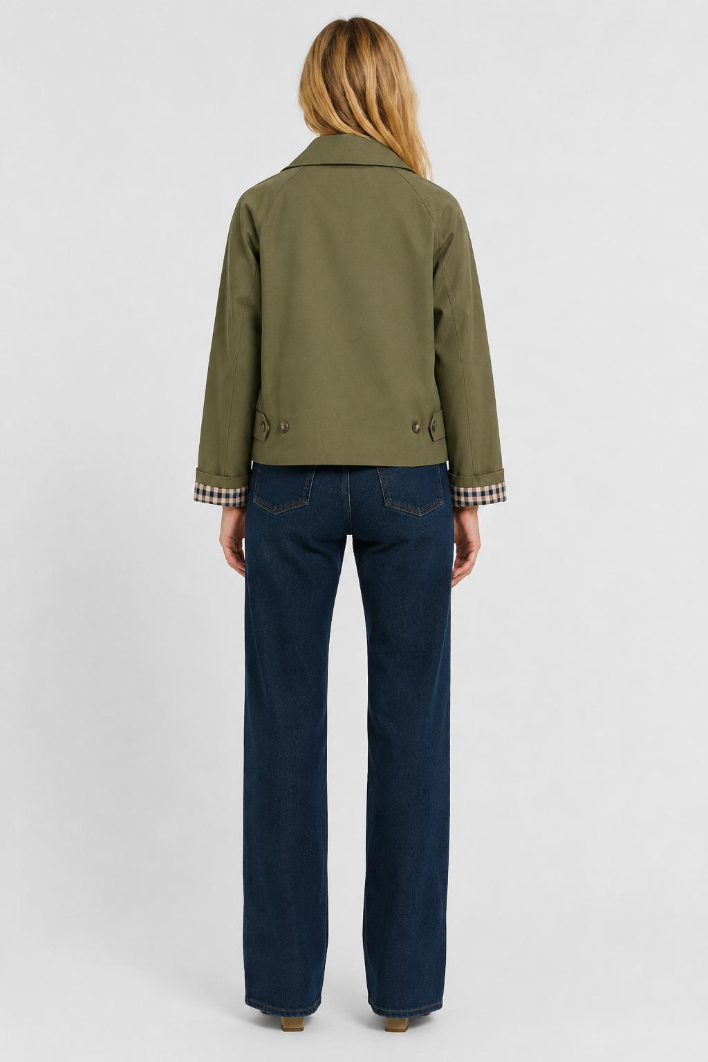 Full-length back view of the olive green jacket showing the plain back, buttoned tabs and gingham cuff lining. 12