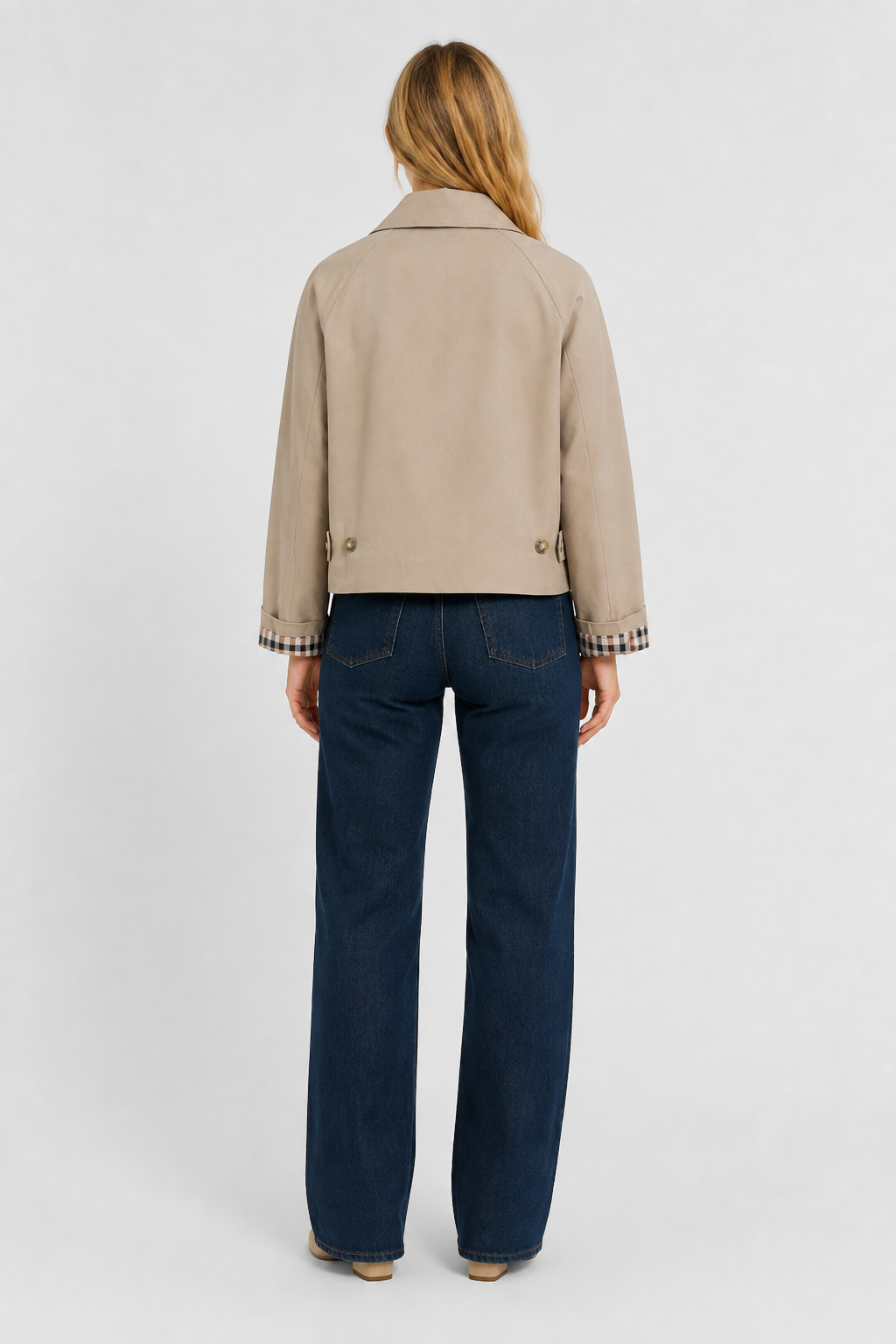 Full-length back view of the beige jacket, cropped above the hips, with buttoned back tabs and gingham cuffs. 6