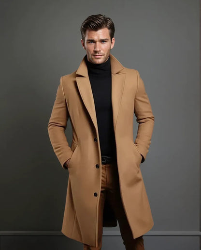 Full-length view of the camel coat on a model with swept-back hair, showing the lapels, three buttons and knee-length cut. 5