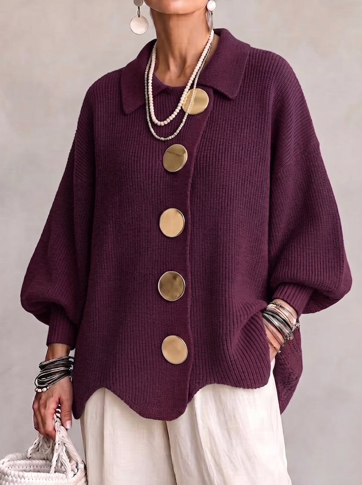 Front view of the plum purple version worn by a model, with large gold buttons, balloon sleeves and scalloped hem. 3