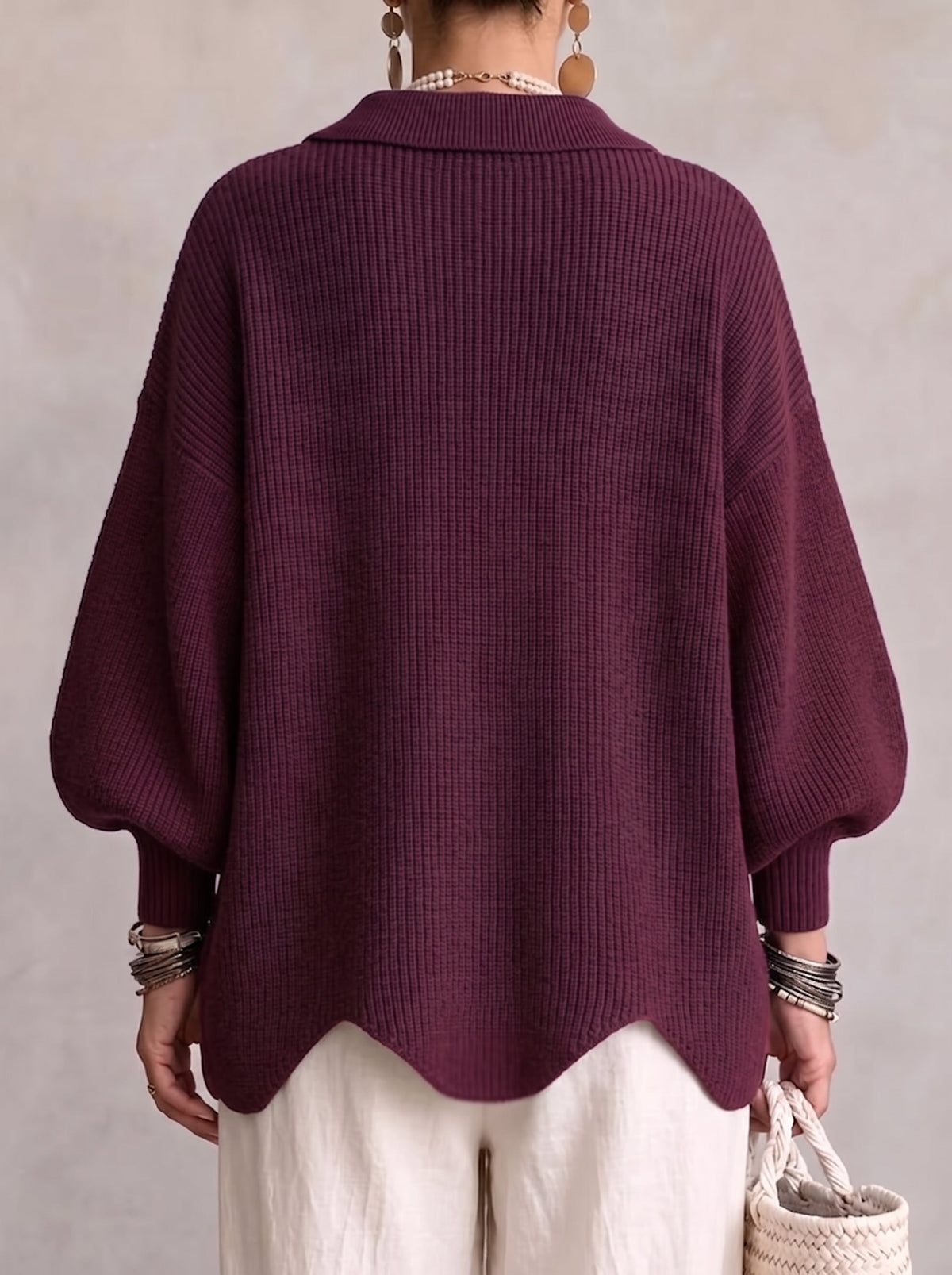 Back view of the plum version, showing plain ribbed knit, puffed sleeves and scalloped hem 15