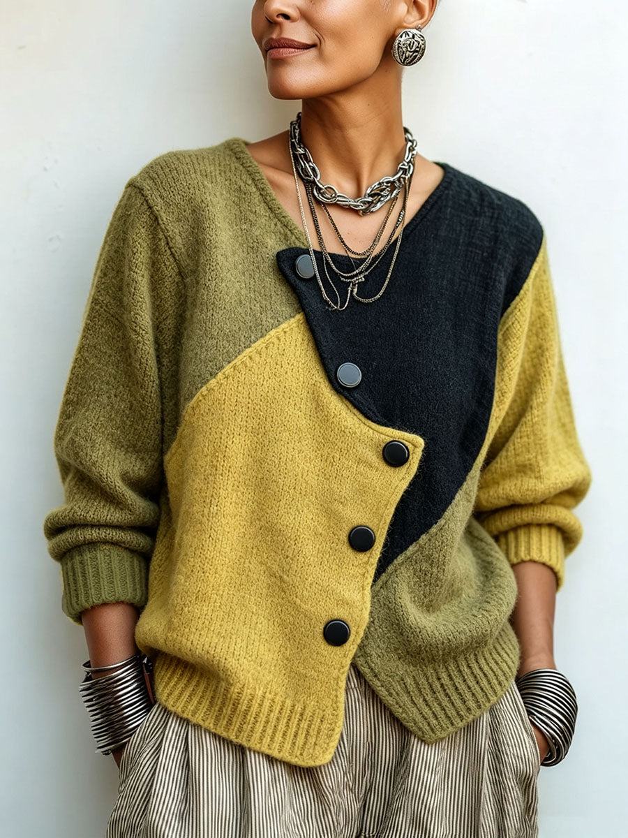 Close-up of the olive, mustard and black knit sweater worn with layered silver necklaces and bangles 1
