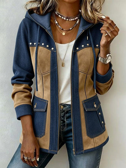Front view of the zipped-open blue denim and tan suede-effect hooded jacket worn over a white top, showing flap pockets and studs. 1