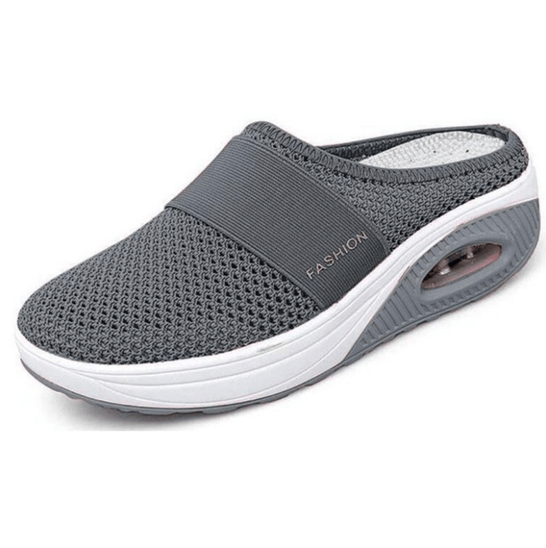 Dark grey mesh backless slip-on with elastic strap and white platform sole, shown from the front three-quarter angle 1