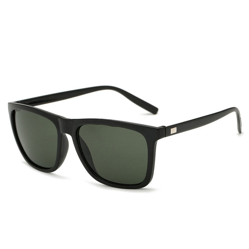 Angled view of black-framed sunglasses with dark green tinted lenses 11