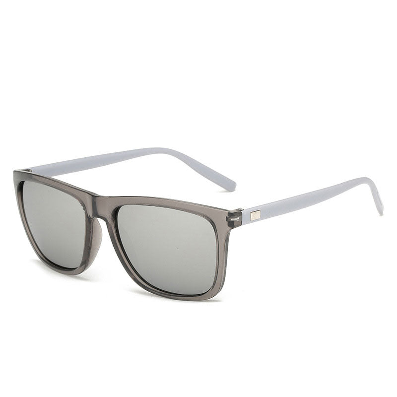 Angled view of sunglasses with translucent grey frame, pale grey arms and silver mirrored lenses 14