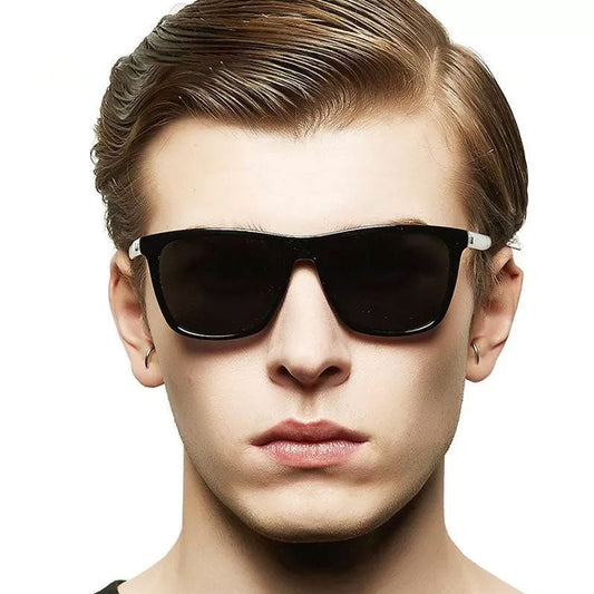 Close-up of a young man wearing the black square sunglasses with dark lenses, facing the camera 2