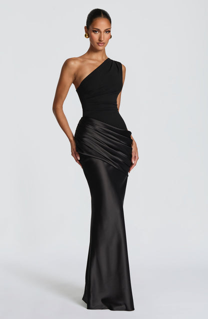 Front view of the black one-shoulder gown on a model, with pleated bodice and draped satin waist 22