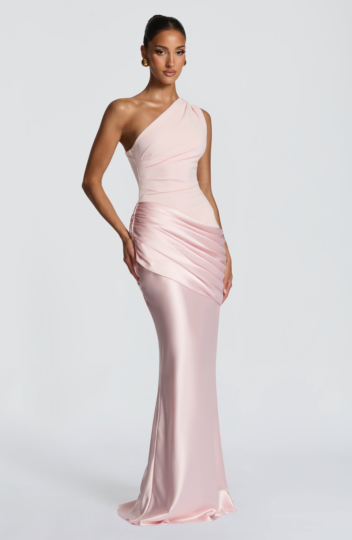 Back view of the blush pink one-shoulder dress, showing the asymmetric neckline, smooth back and draped satin hip. 29