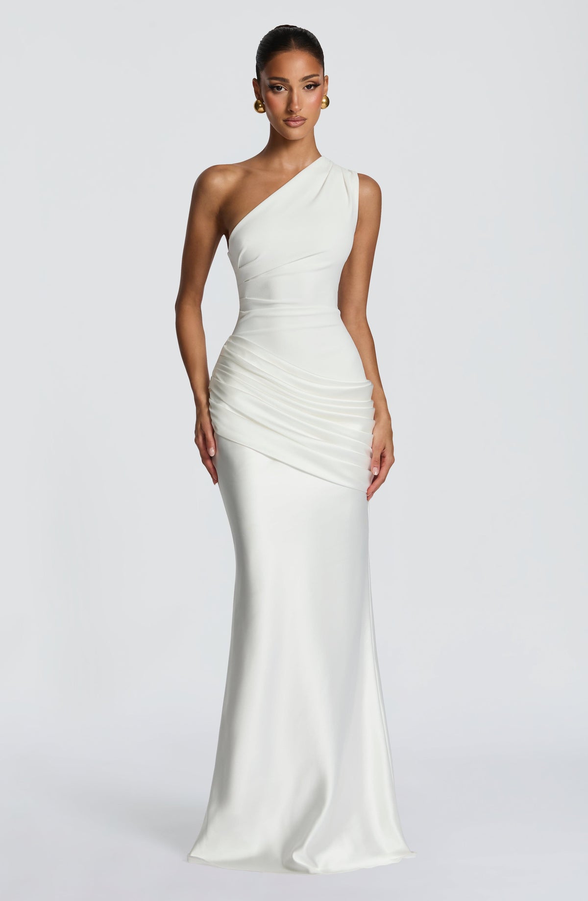 Front view of the one-shoulder maxi dress in white on a model, showing the ruched bodice and draped satin hip. 22