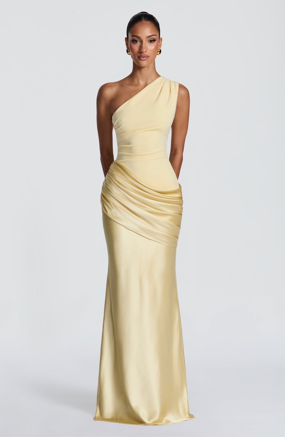 Full-length front view of the dress in pale butter yellow, one-shoulder crepe bodice with ruched satin hip drape. 45