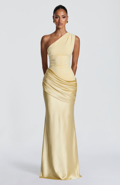 Full-length front view of the dress in pale butter yellow, one-shoulder crepe bodice with ruched satin hip drape. 45
