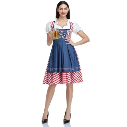 Full-length front view of the red check dirndl with navy apron, worn by a model holding a beer glass. 7