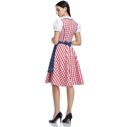 Back view of the red check dirndl showing the checked back bodice and the navy apron tied in a bow at the waist. 8