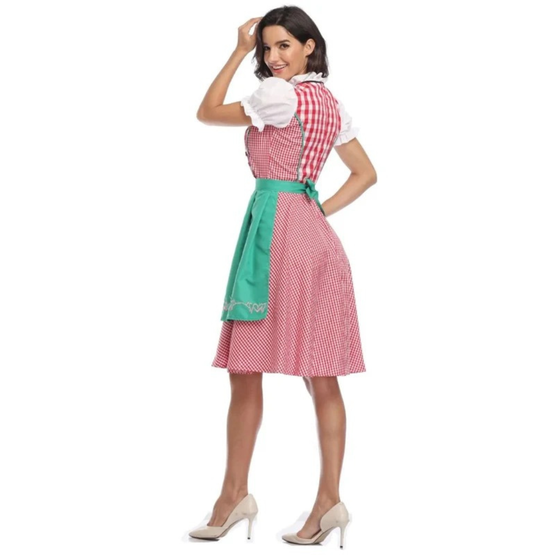 Back view of the red check dirndl with green apron tied in a bow, the model smiling over her shoulder. 10