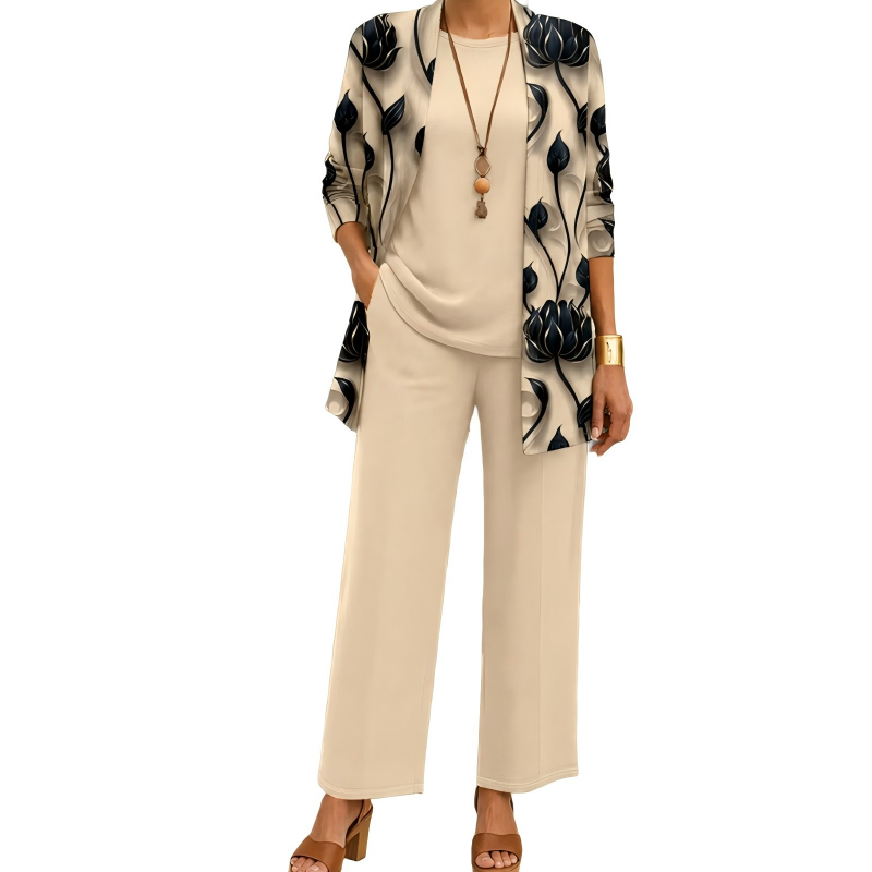 Model wearing the beige set: black lotus-print open cardigan over a plain round-neck top and wide-leg trousers, with a long pendant necklace. 1