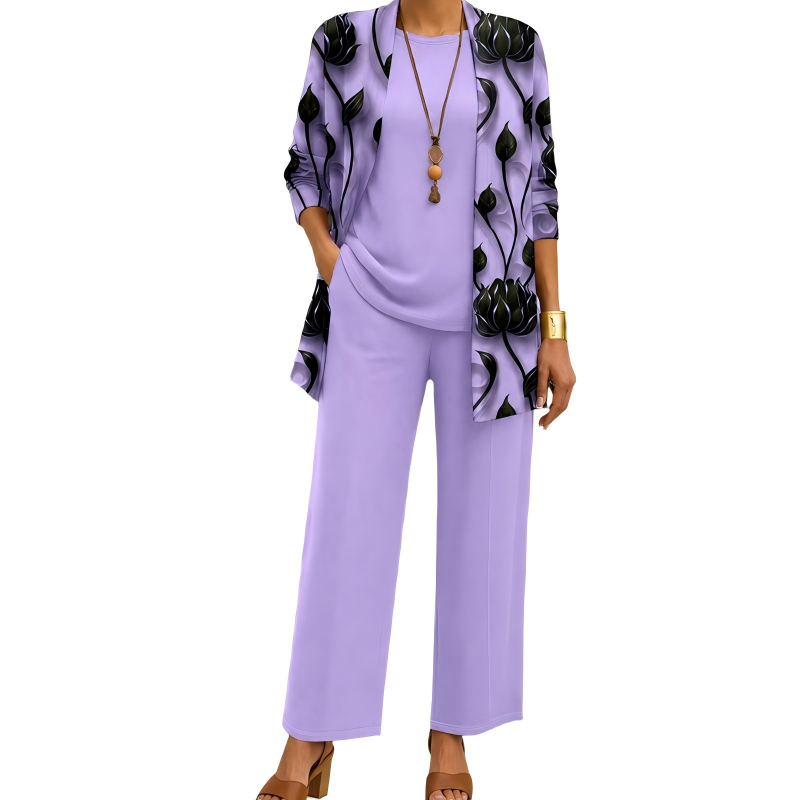 Model wearing the lilac set with black lotus-print open cardigan, plain round-neck top and wide-leg trousers, with tan block-heel sandals. 4