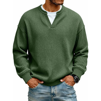 Front view of the waffle knit top in forest green over a white tee 18
