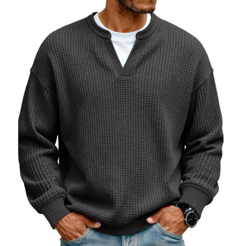 Front view of the waffle knit top in charcoal black over a white tee 15
