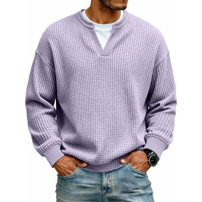 Front view of the waffle knit top in lilac over a white tee, hands in pockets 19