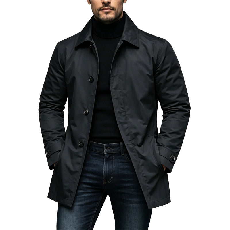 Man wearing the single-breasted coat in black over a black roll neck and dark jeans 1