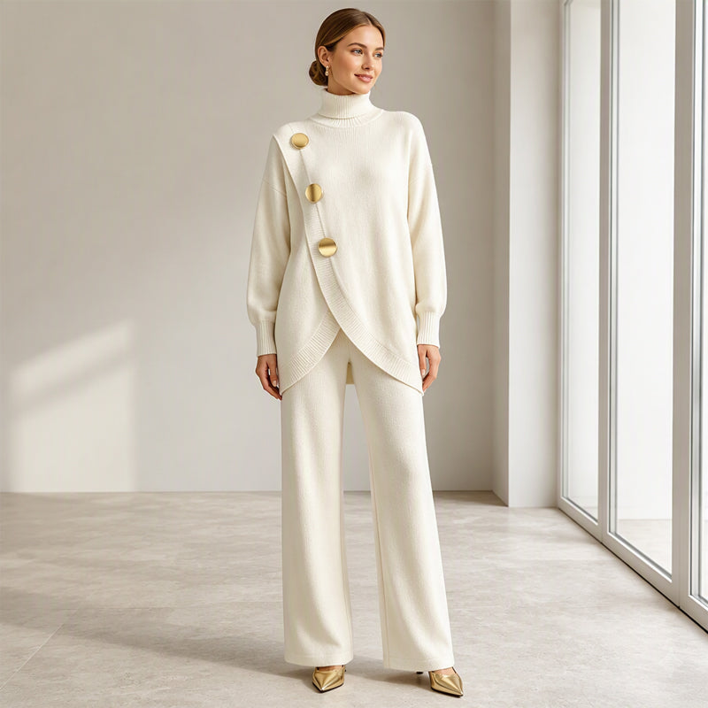 Model smiling in the cream knit set, arms relaxed, seen full length with gold heels 7