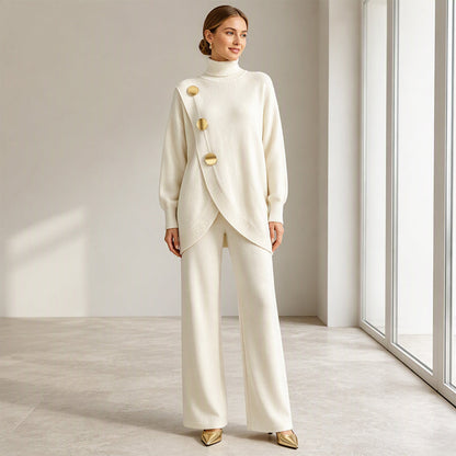 Model smiling in the cream knit set, arms relaxed, seen full length with gold heels 7