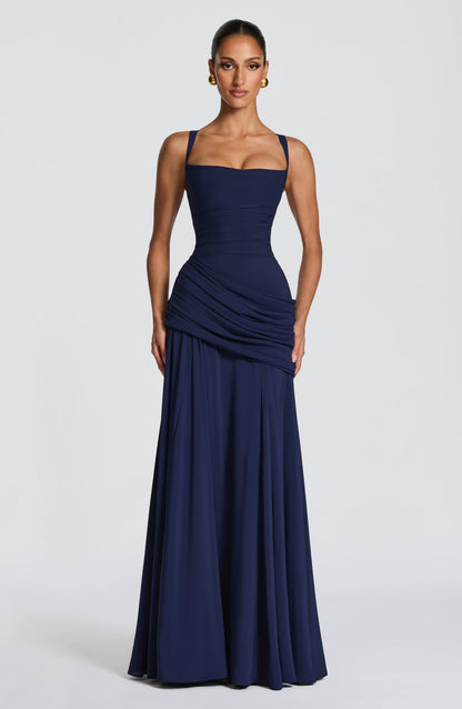 Navy maxi dress on a model facing forward, with square neckline, ruched waist and full skirt 5