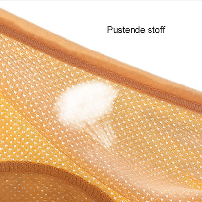 Close-up of the perforated breathable mesh fabric inside a pair of mustard-orange briefs, with a faint airflow graphic. 10