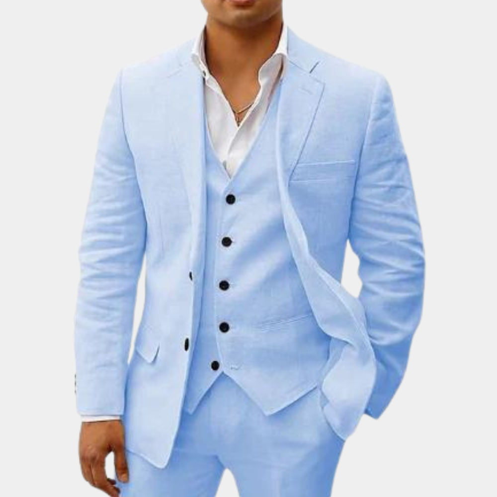 Model wearing the suit in pale sky blue, with jacket, five-button vest and trousers shown from the front. 4