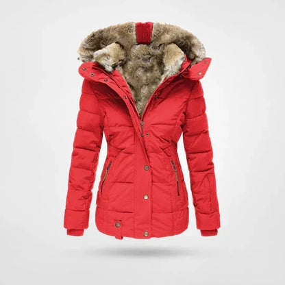 Front view of the quilted hooded jacket in bright red, with a plush fur-lined hood, press studs and zipped hand pockets. 4