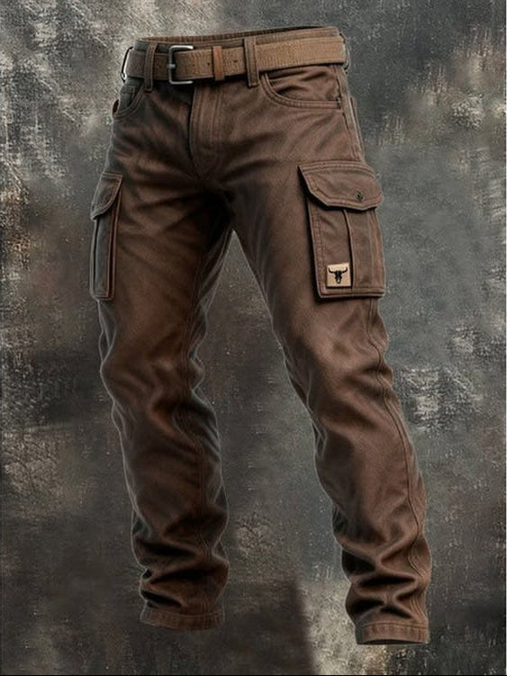 Brown cargo trousers with a matching belt shown whole against a textured grey backdrop 1