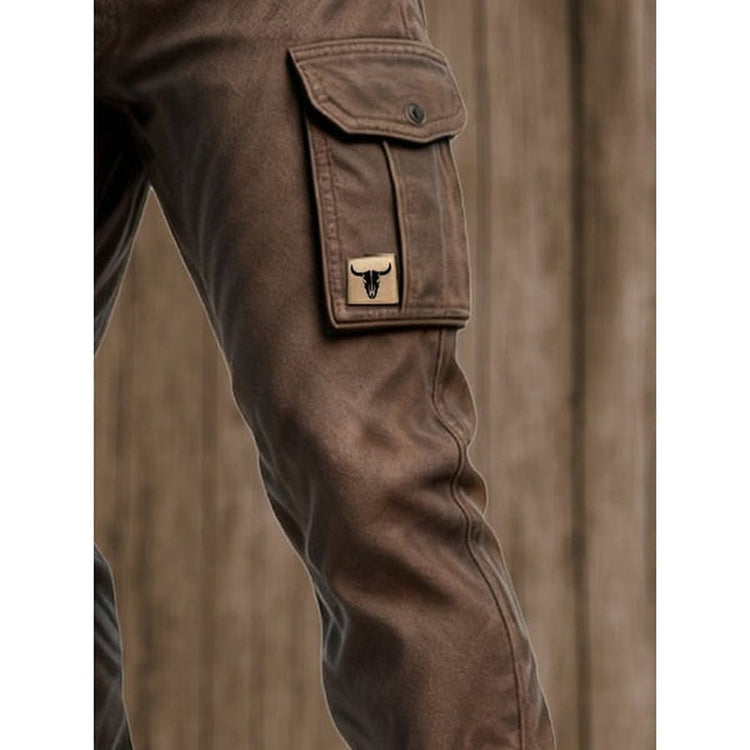 Close-up of the side cargo pocket with button flap and patch, down to the knee 6