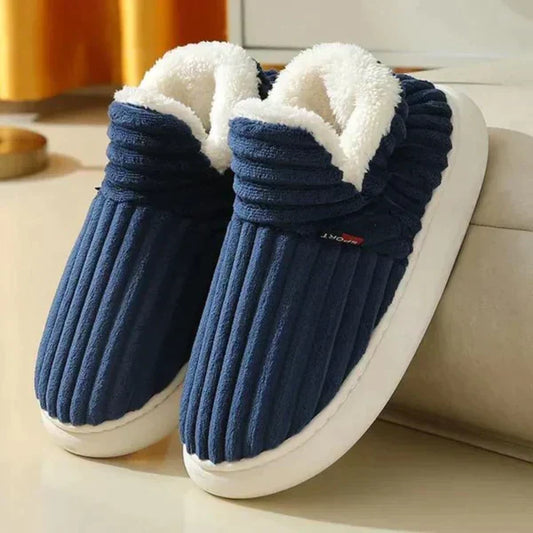 Pair of navy ribbed plush slippers with white fleece lining and thick cream sole 1