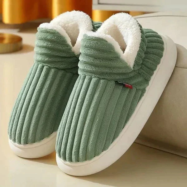 Pair of green ribbed plush slippers with white fleece lining and thick cream sole 4