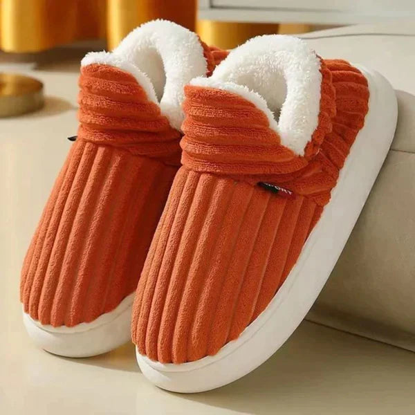 Pair of burnt-orange ribbed plush slippers with white fleece lining and thick cream sole 6